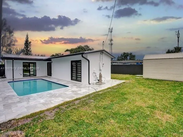 a front view of house with yard and entertaining space