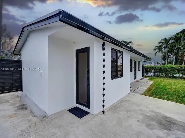 a view of front door and yard