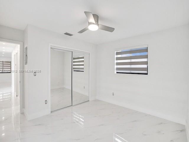 7881 Hope Street Hollywood, FL 33024 - Photo 7 of 39 a view of a livingroom with a ceiling fan and window