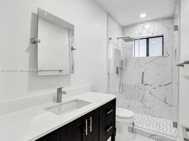 7881 Hope Street Hollywood, FL 33024 - Photo 9 of 39 a bathroom with a sink a toilet and shower