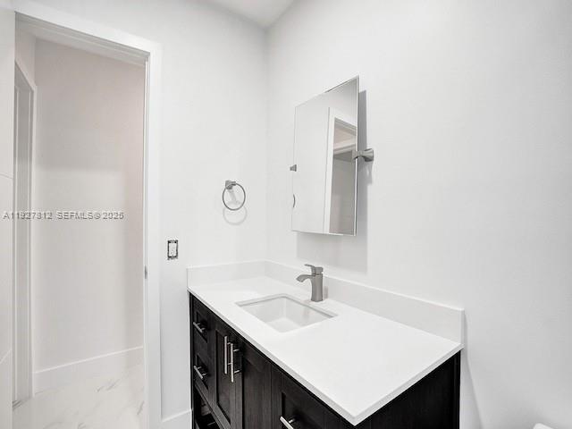 7881 Hope Street Hollywood, FL 33024 - Photo 10 of 39 a bathroom with a sink vanity and a mirror