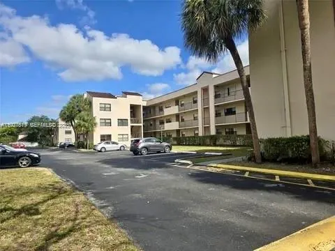 a view of a street in front of a building