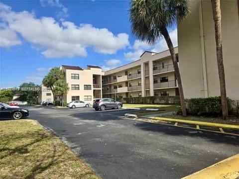 3470 Foxcroft Road, Unit 308 Miramar, FL 33025 - Photo 15 of 15 a view of a street in front of a building