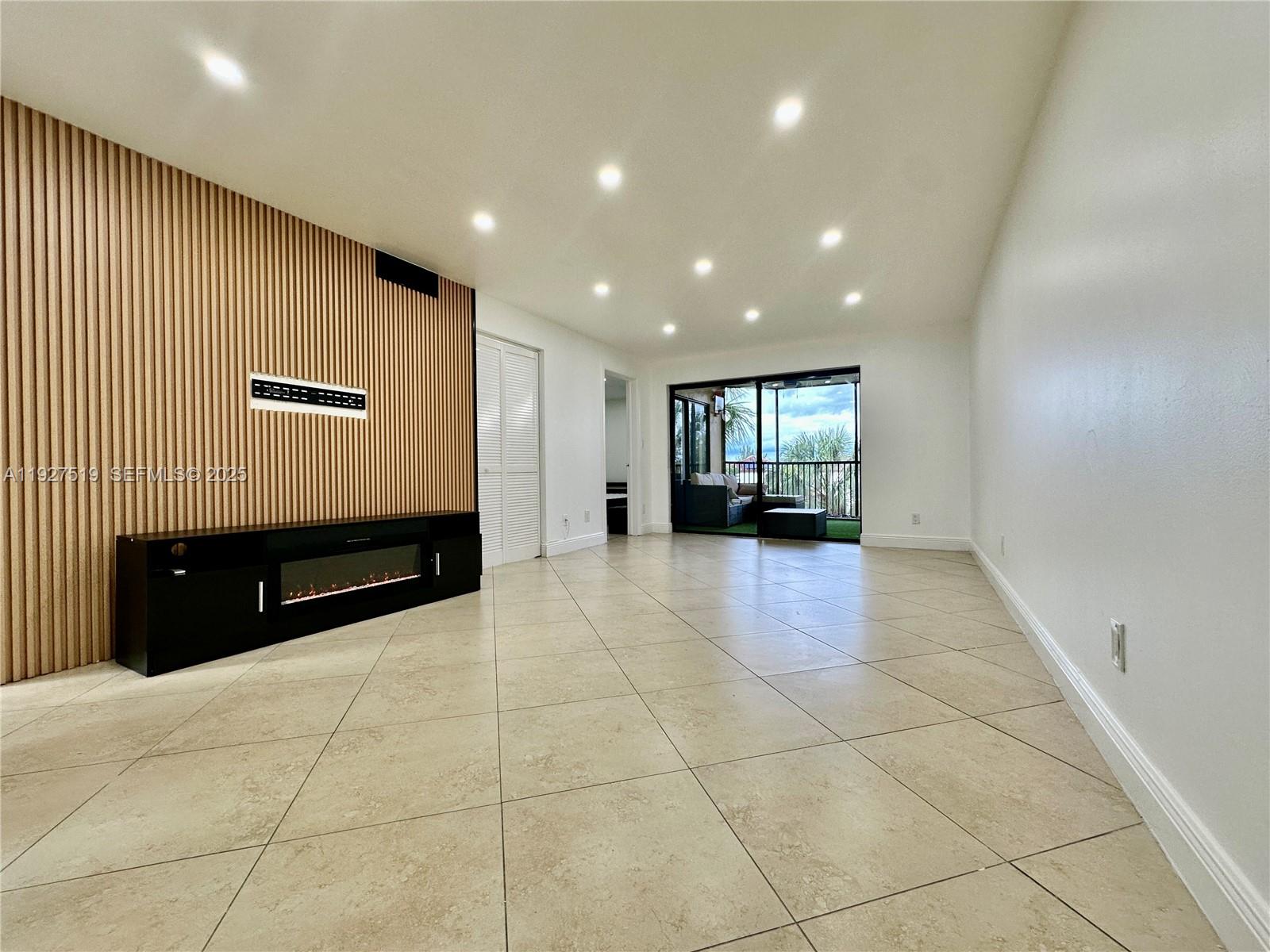3470 Foxcroft Road, Unit 308 Miramar, FL 33025 - Photo 3 of 15 a view of an empty room with a window