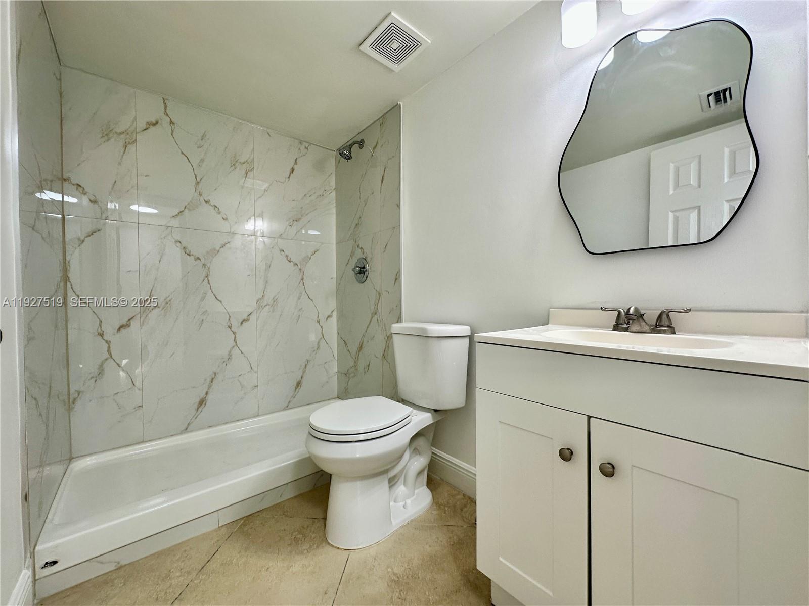 3470 Foxcroft Road, Unit 308 Miramar, FL 33025 - Photo 5 of 15 a bathroom with a sink toilet and shower