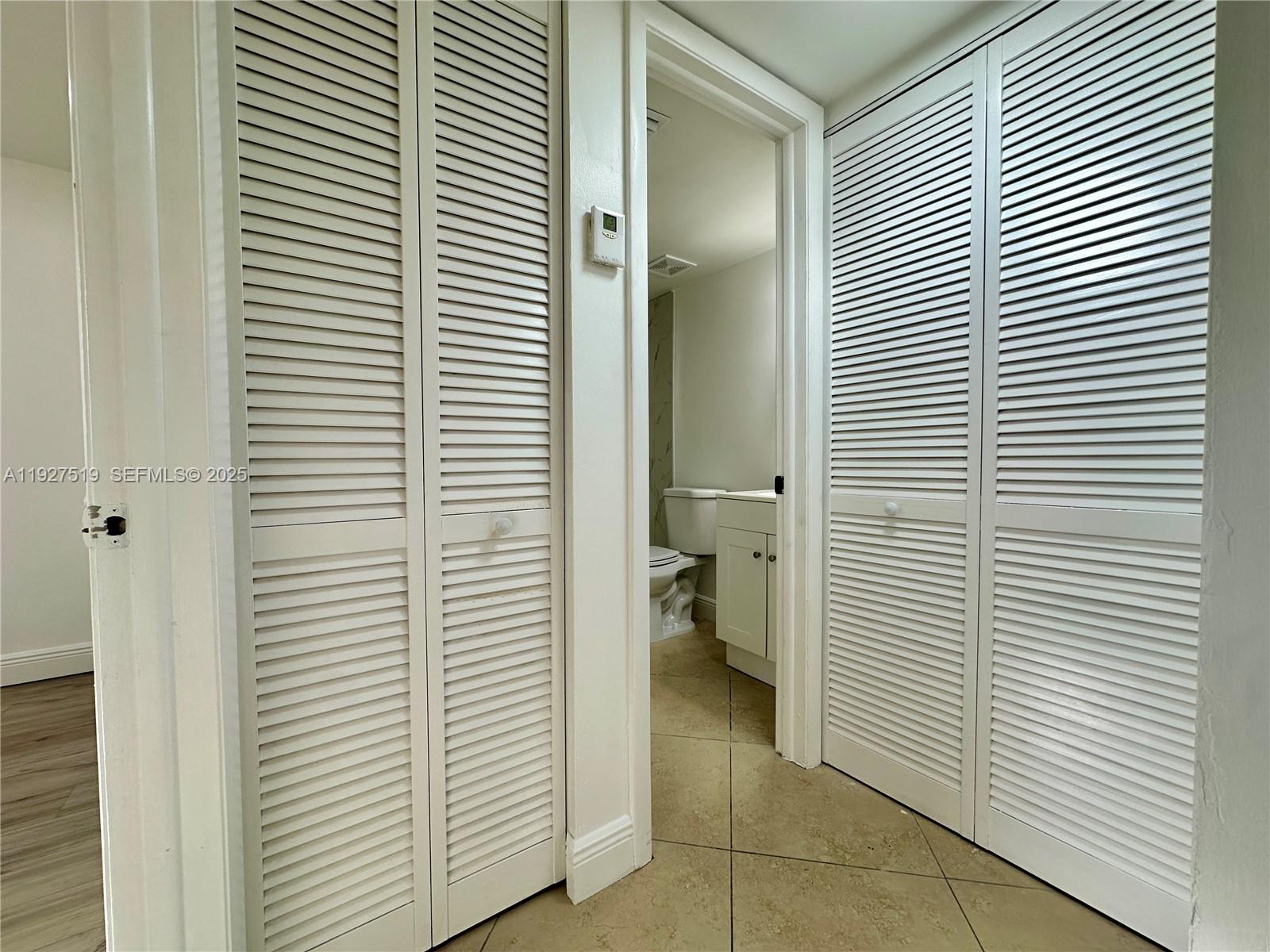 3470 Foxcroft Road, Unit 308 Miramar, FL 33025 - Photo 6 of 15 a view of a bathroom with a sink and a toilet