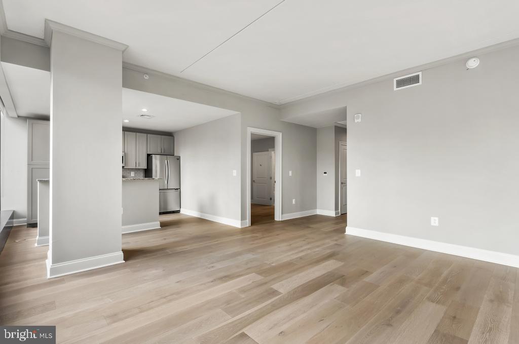 30 North 23rd Street, Unit 2402 Philadelphia, PA 19103 - Photo 10 of 42 a view of empty room with wooden floor