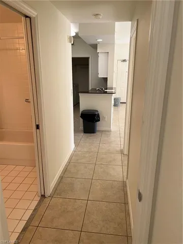 a view of a kitchen from the hallway