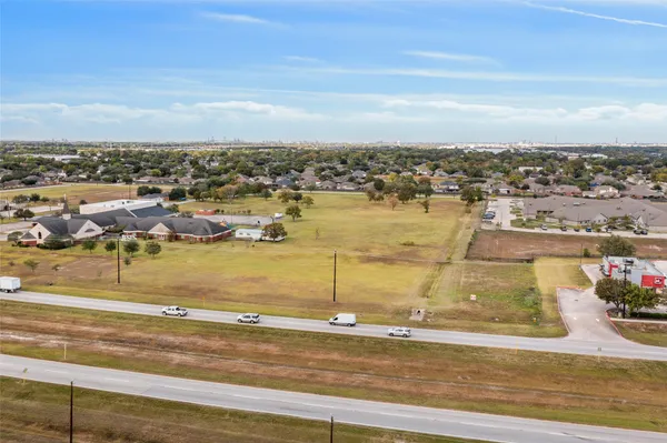 an aerial view of residential building and ocean