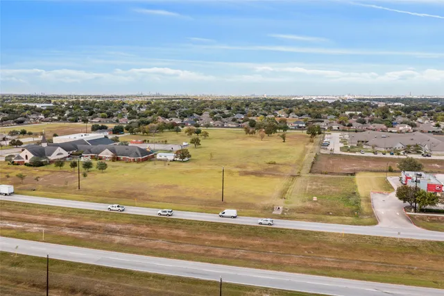 an aerial view of residential building and ocean