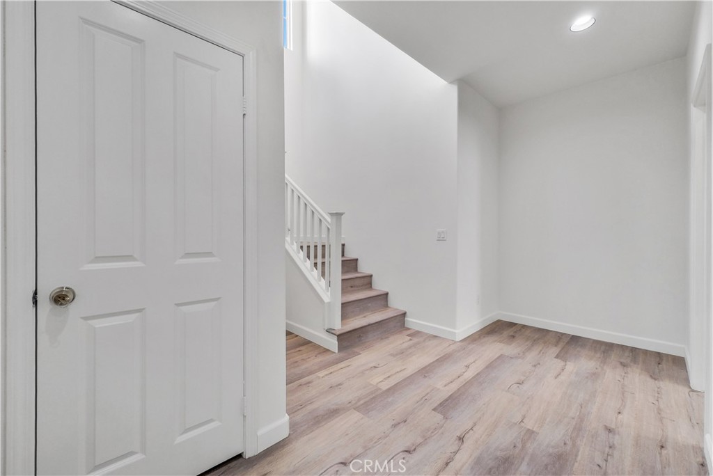 180 Heartwood Way Anaheim, CA 92801 - Photo 16 of 38 a view of entryway with wooden floor