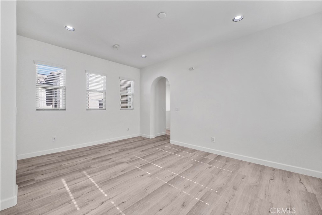 180 Heartwood Way Anaheim, CA 92801 - Photo 29 of 38 wooden floor in an empty room with a window