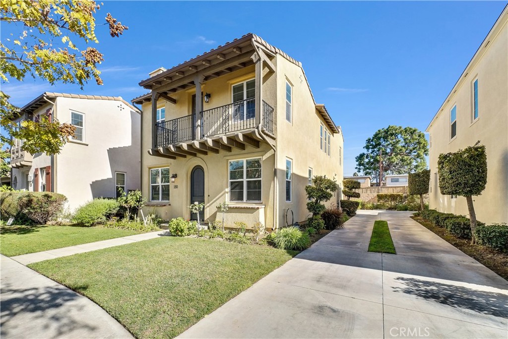 180 Heartwood Way Anaheim, CA 92801 - Photo 3 of 38 a front view of a house with a yard