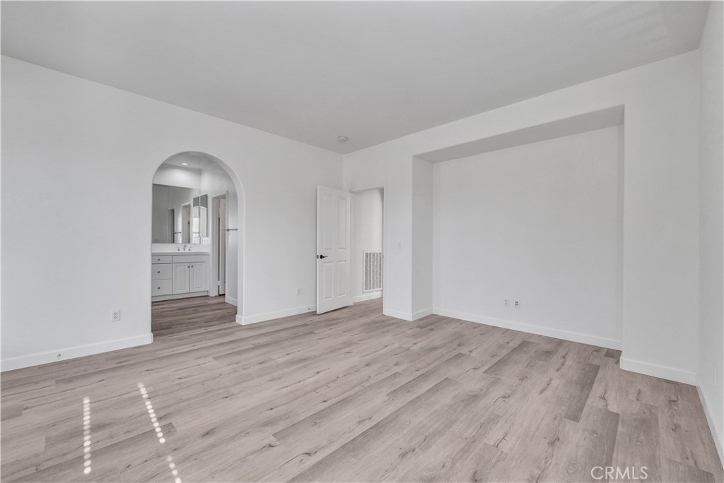 180 Heartwood Way Anaheim, CA 92801 - Photo 31 of 38 wooden floor in an empty room with a window