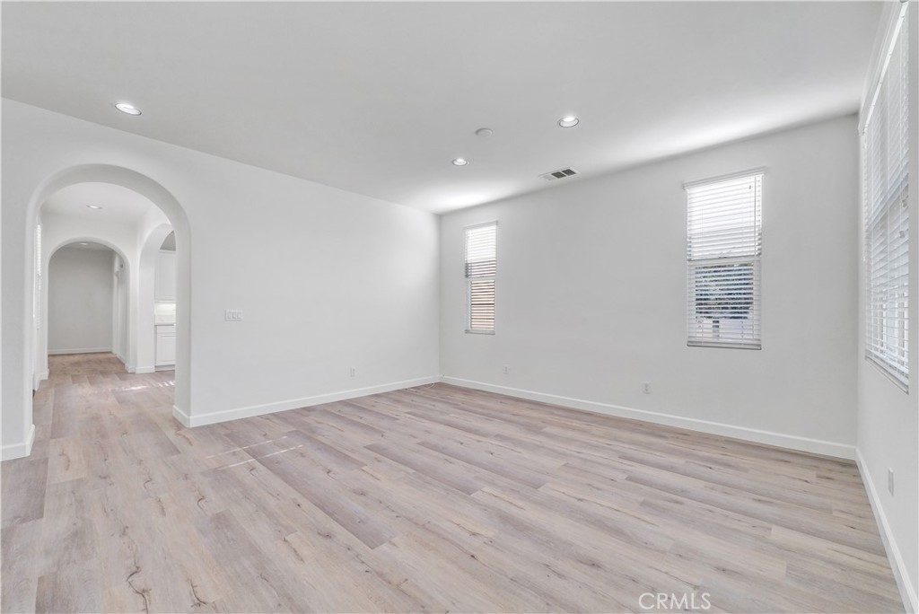 180 Heartwood Way Anaheim, CA 92801 - Photo 5 of 38 wooden floor in an empty room with a window