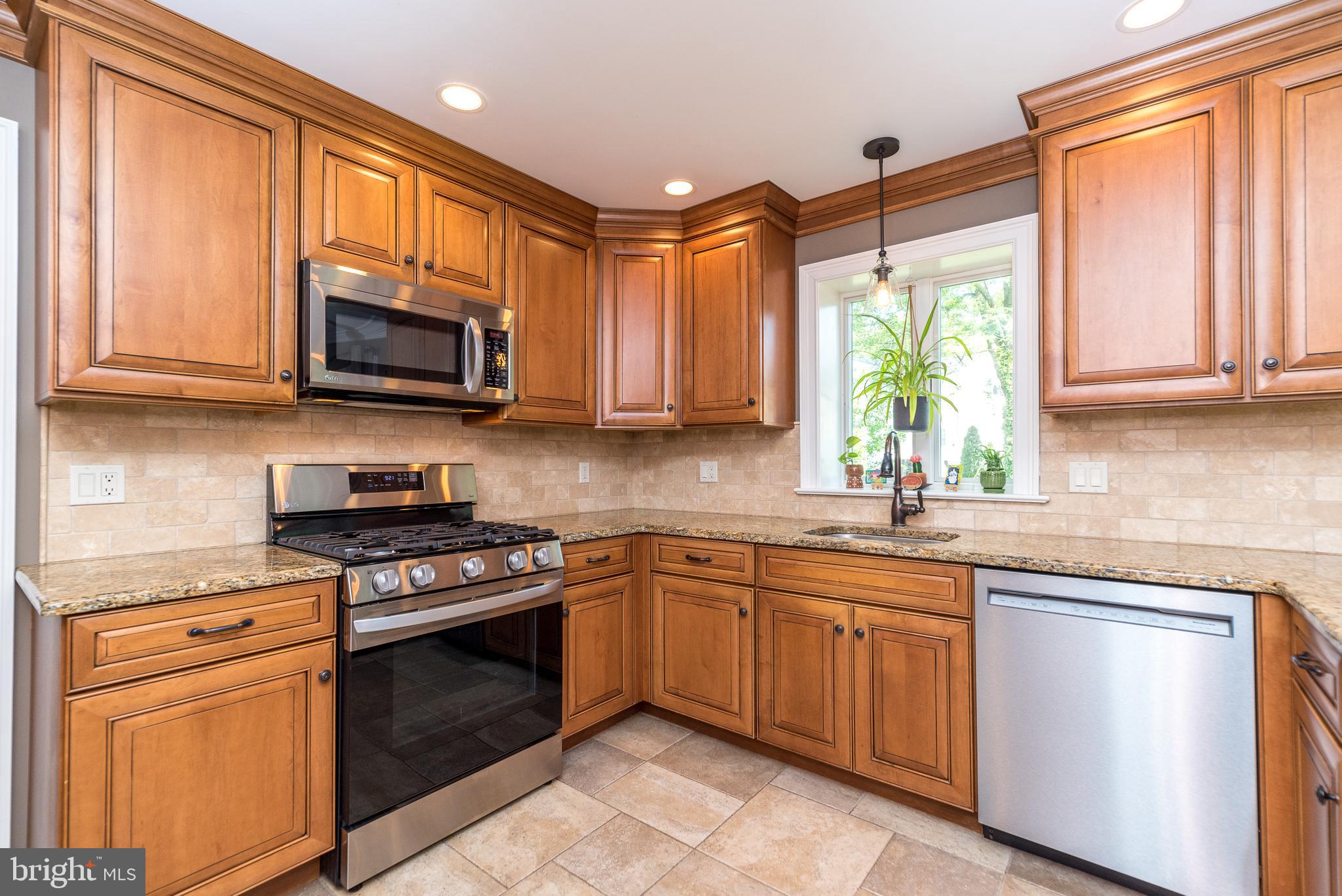 43 Clemens Road Doylestown, PA 18901 - Photo 11 of 34 a kitchen with stainless steel appliances granite countertop white cabinets granite counter tops and a window