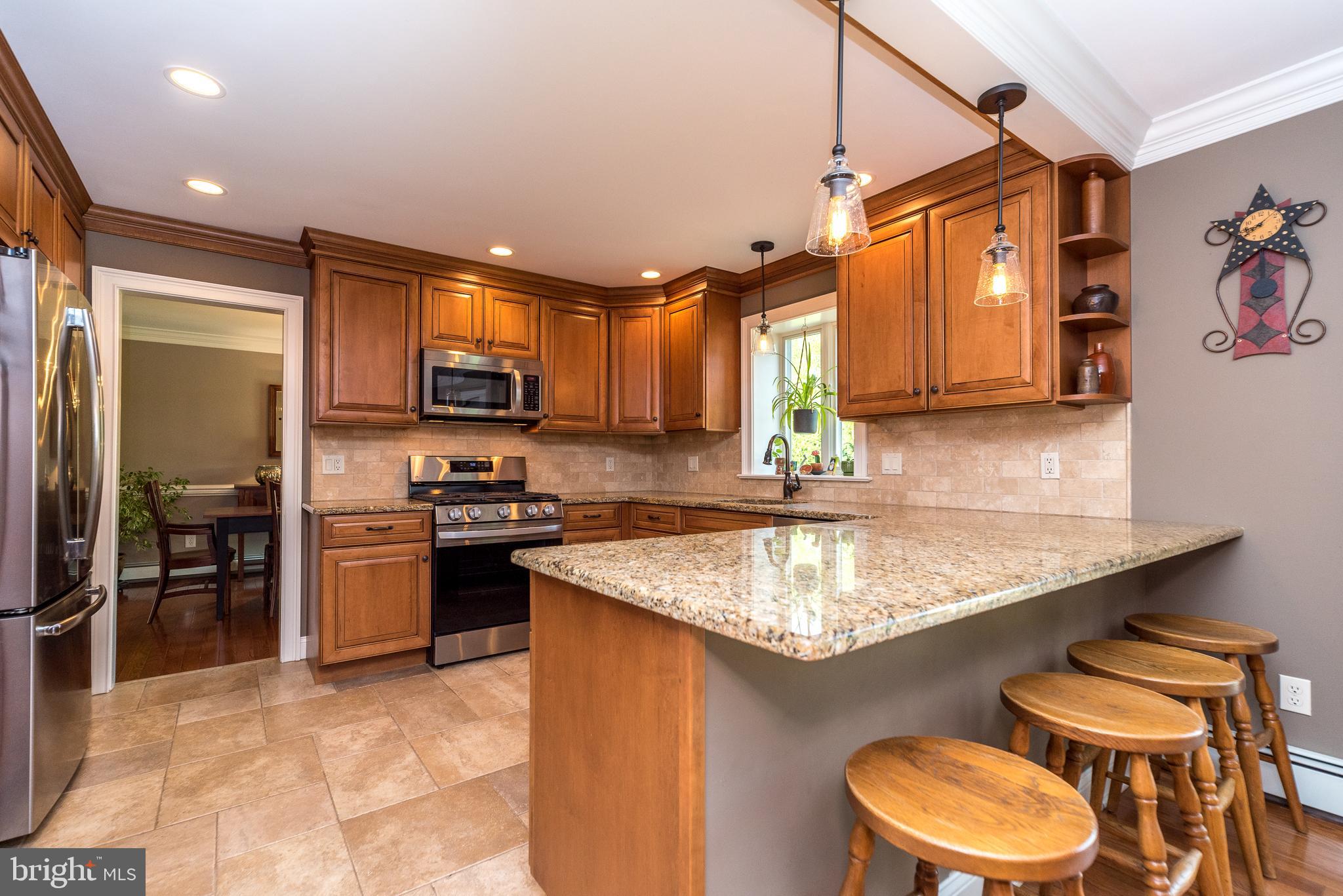 43 Clemens Road Doylestown, PA 18901 - Photo 12 of 34 a kitchen with stainless steel appliances granite countertop a sink stove and refrigerator