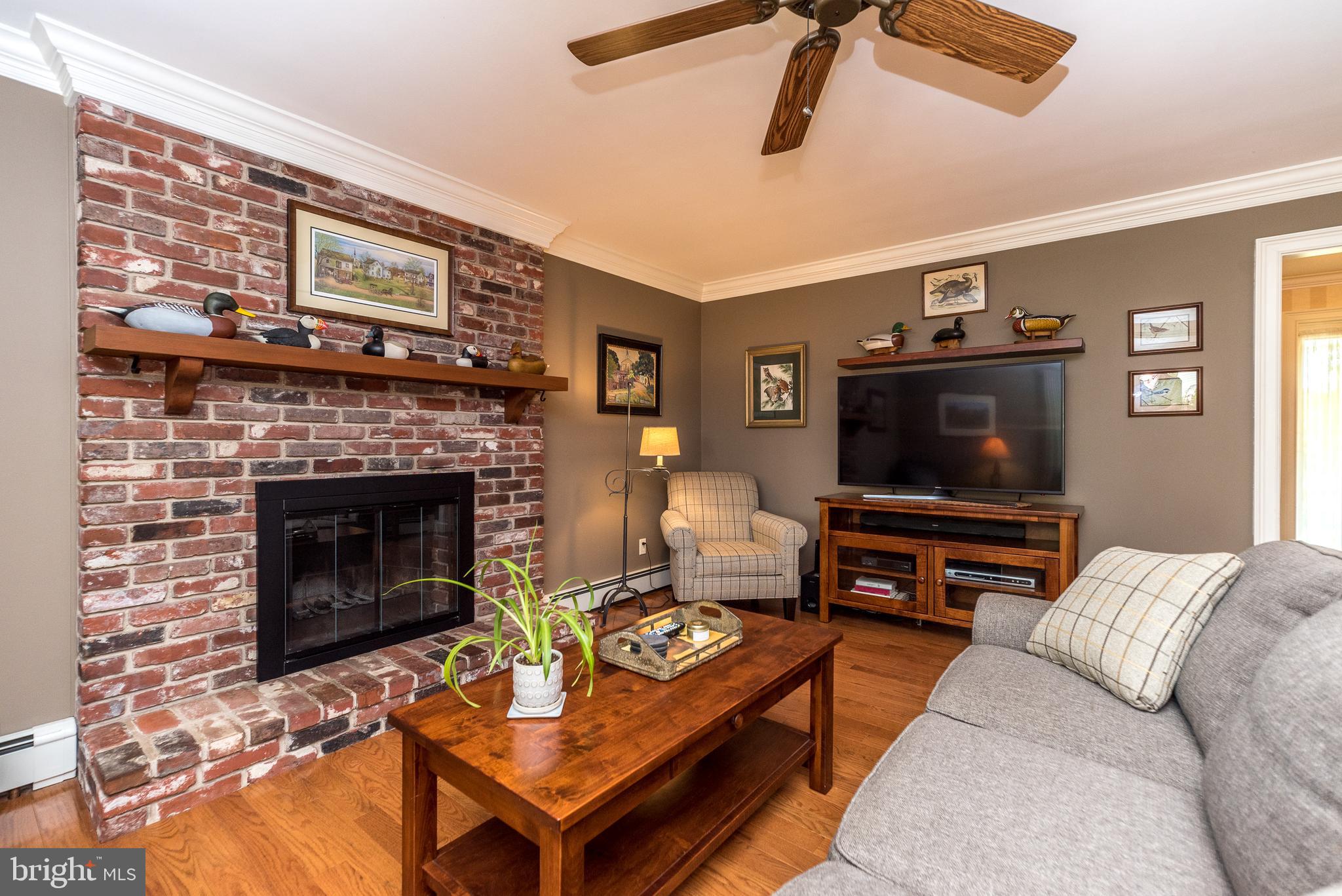 43 Clemens Road Doylestown, PA 18901 - Photo 14 of 34 a living room with furniture a flat screen tv and a fireplace