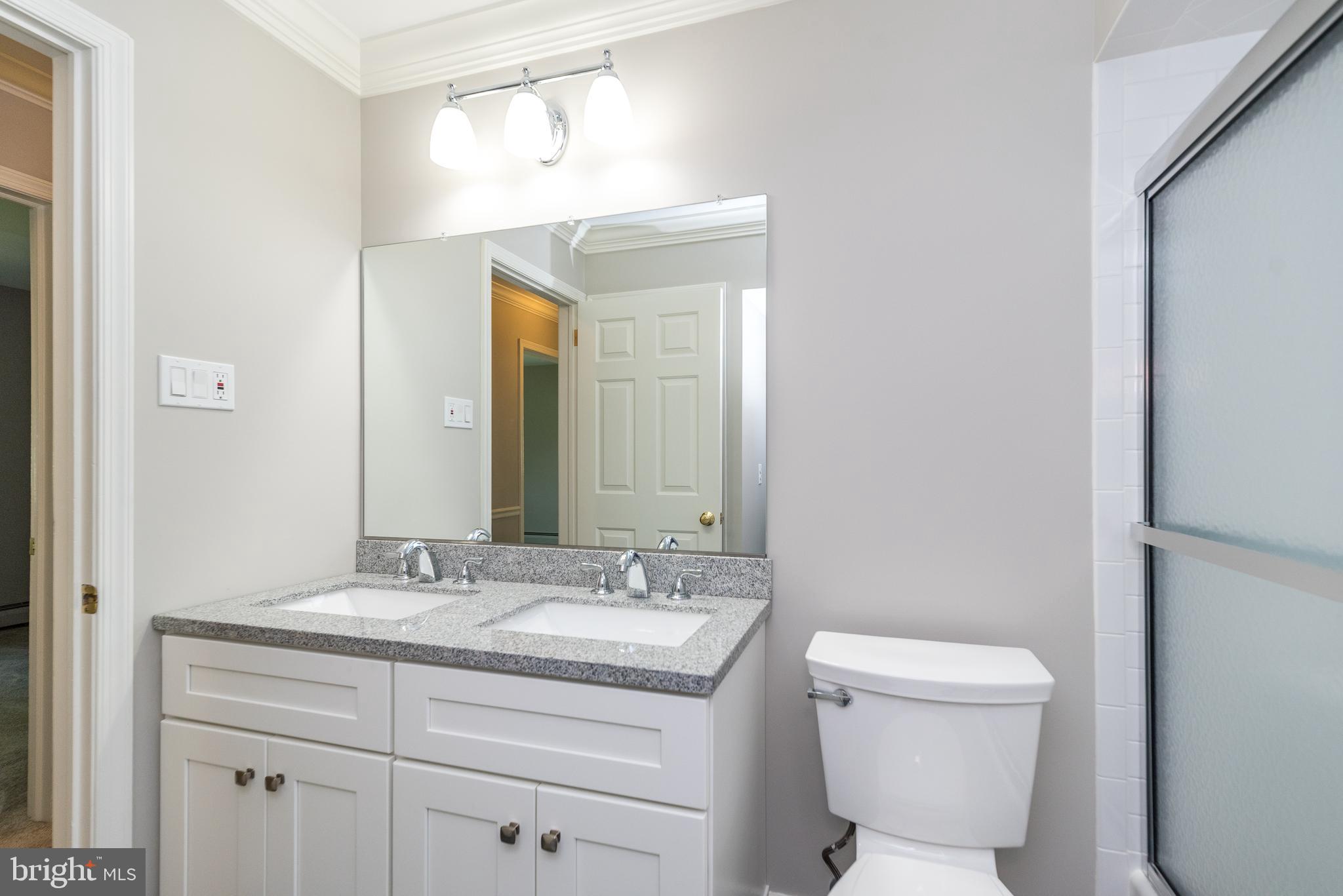 43 Clemens Road Doylestown, PA 18901 - Photo 28 of 34 a bathroom with a toilet a sink and mirror