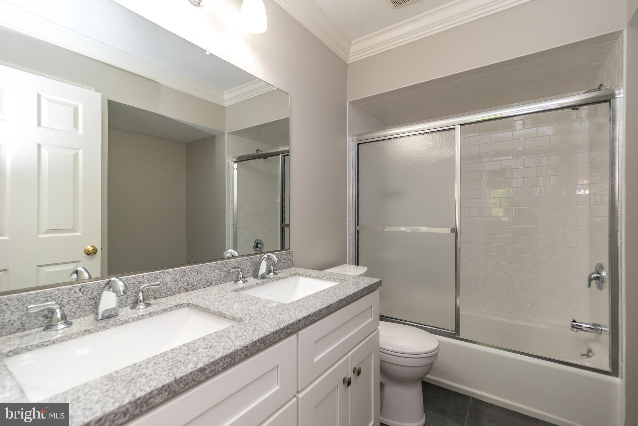 43 Clemens Road Doylestown, PA 18901 - Photo 29 of 34 a bathroom with a granite countertop sink toilet and shower