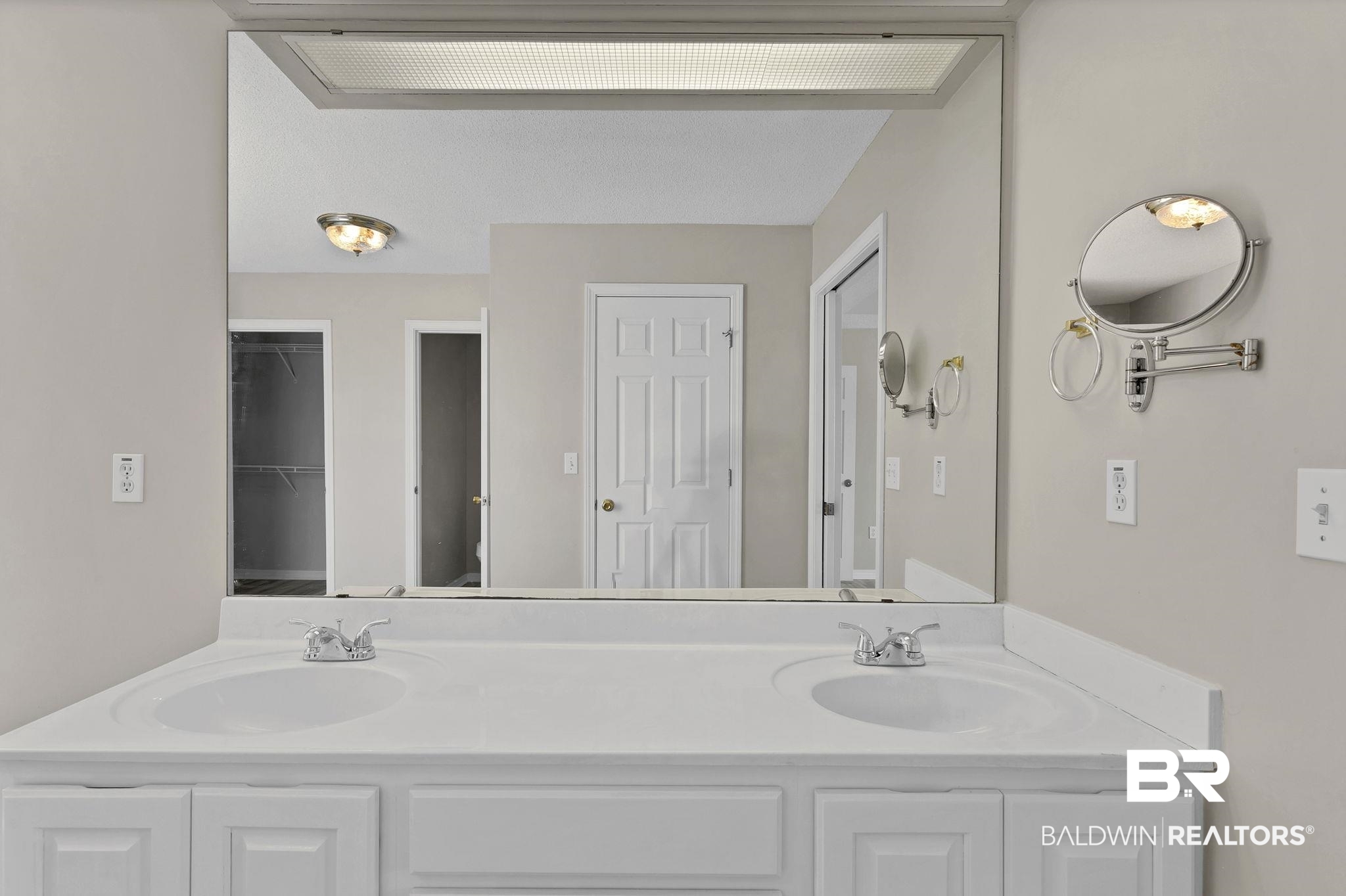 10238 Grove Drive Fairhope, AL 36532 - Photo 17 of 39 Bathroom with 2 closets, a garden tub, separate shower, private water closet, wood finished floors, and double vanity.