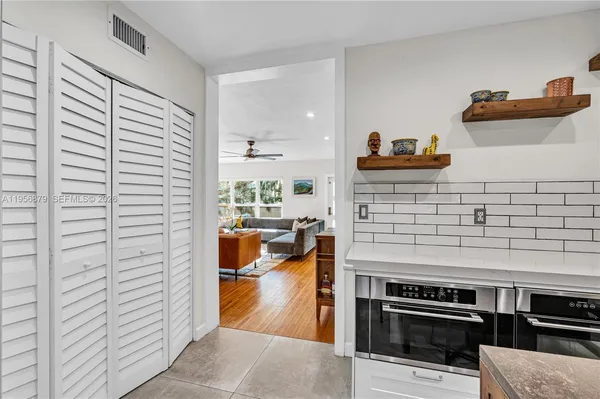 a kitchen with stainless steel appliances and cabinets