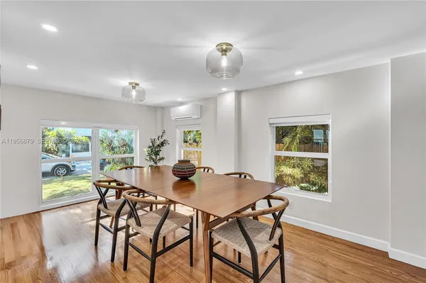 a view of a dining room with furniture window and outside view