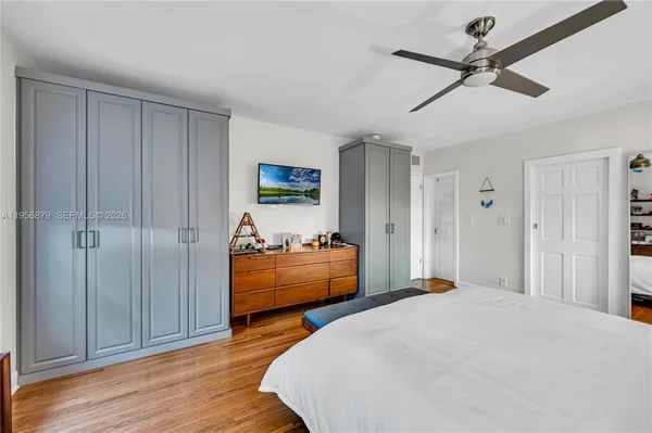 a bedroom with bed and window