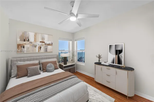 a bedroom with a bed and a dresser