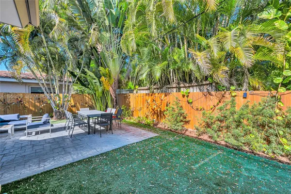 a garden view with a sitting space