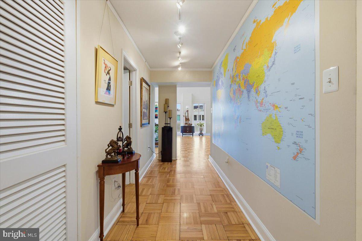 700 7th Street Southwest, Unit 827 Washington, DC 20024 - Photo 11 of 32 Vibrant hallway with world map mural.