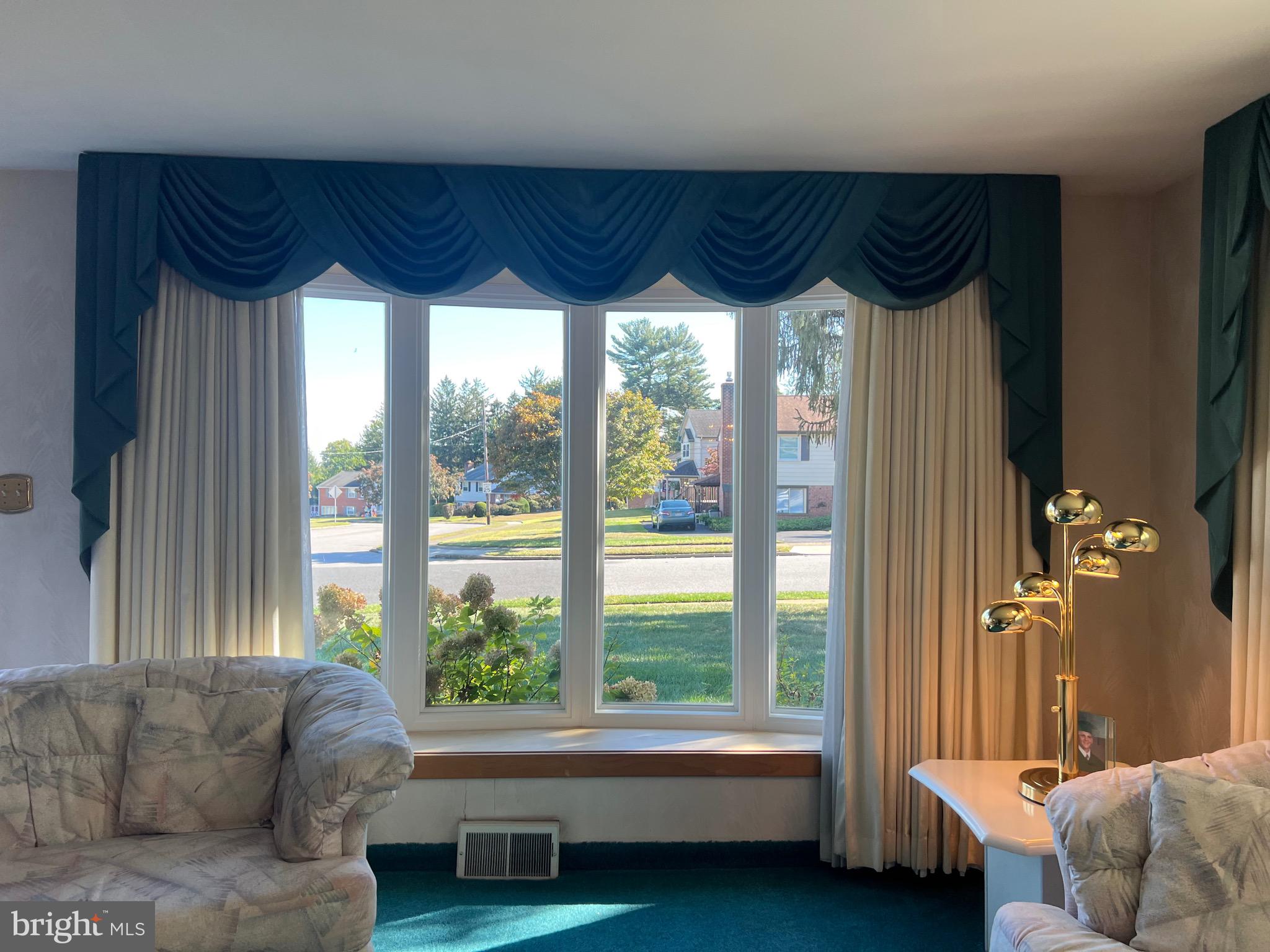 457 Kennerly Road Springfield, PA 19064 - Photo 3 of 9 a living room with furniture and a large window