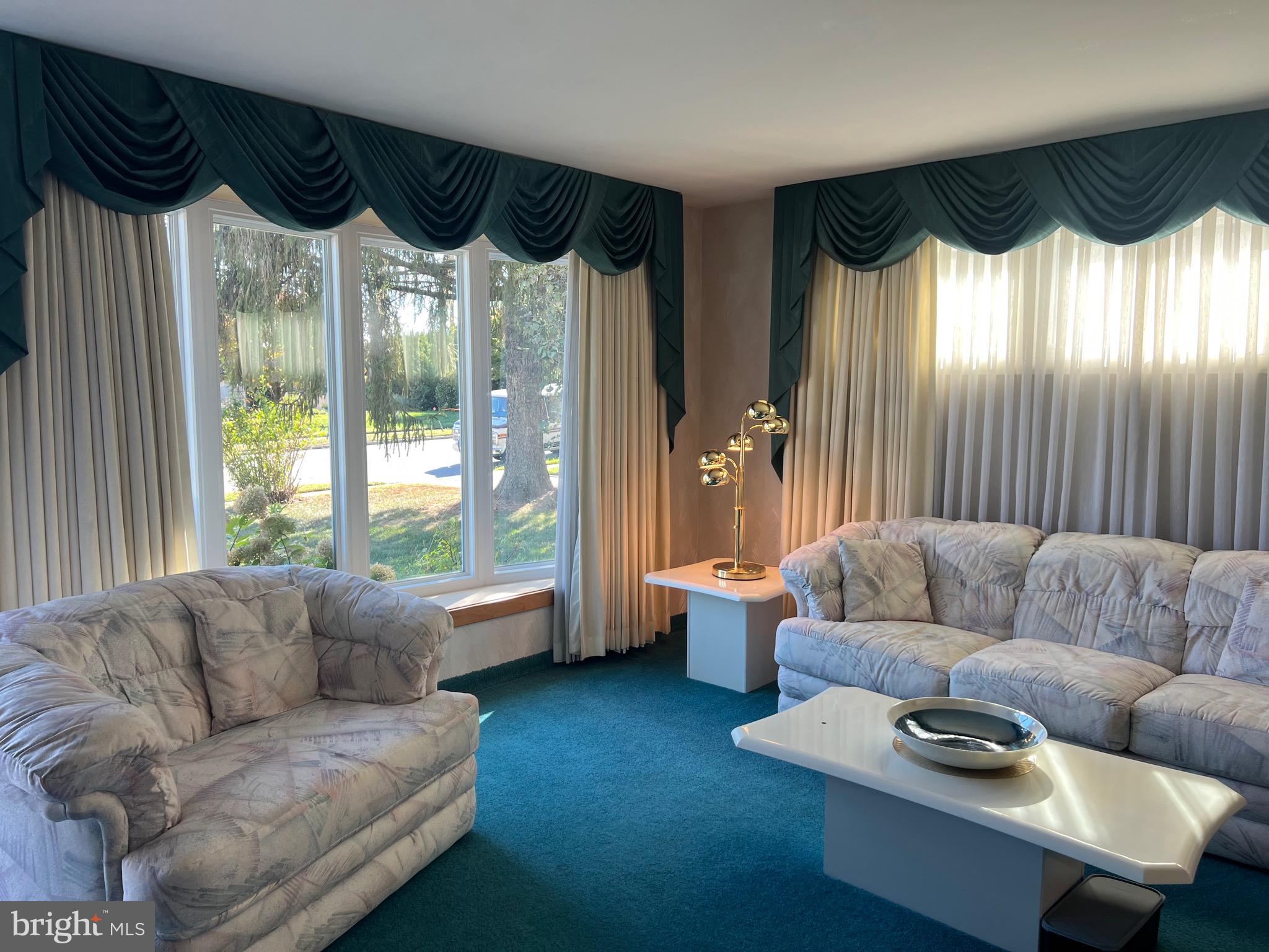 457 Kennerly Road Springfield, PA 19064 - Photo 4 of 9 a living room with furniture and a large window