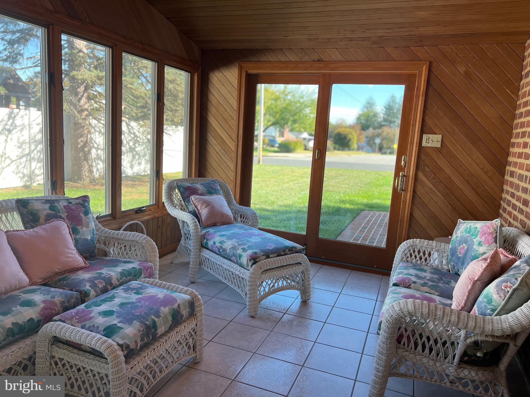 457 Kennerly Road Springfield, PA 19064 - Photo 6 of 9 a living room with furniture and a floor to ceiling window