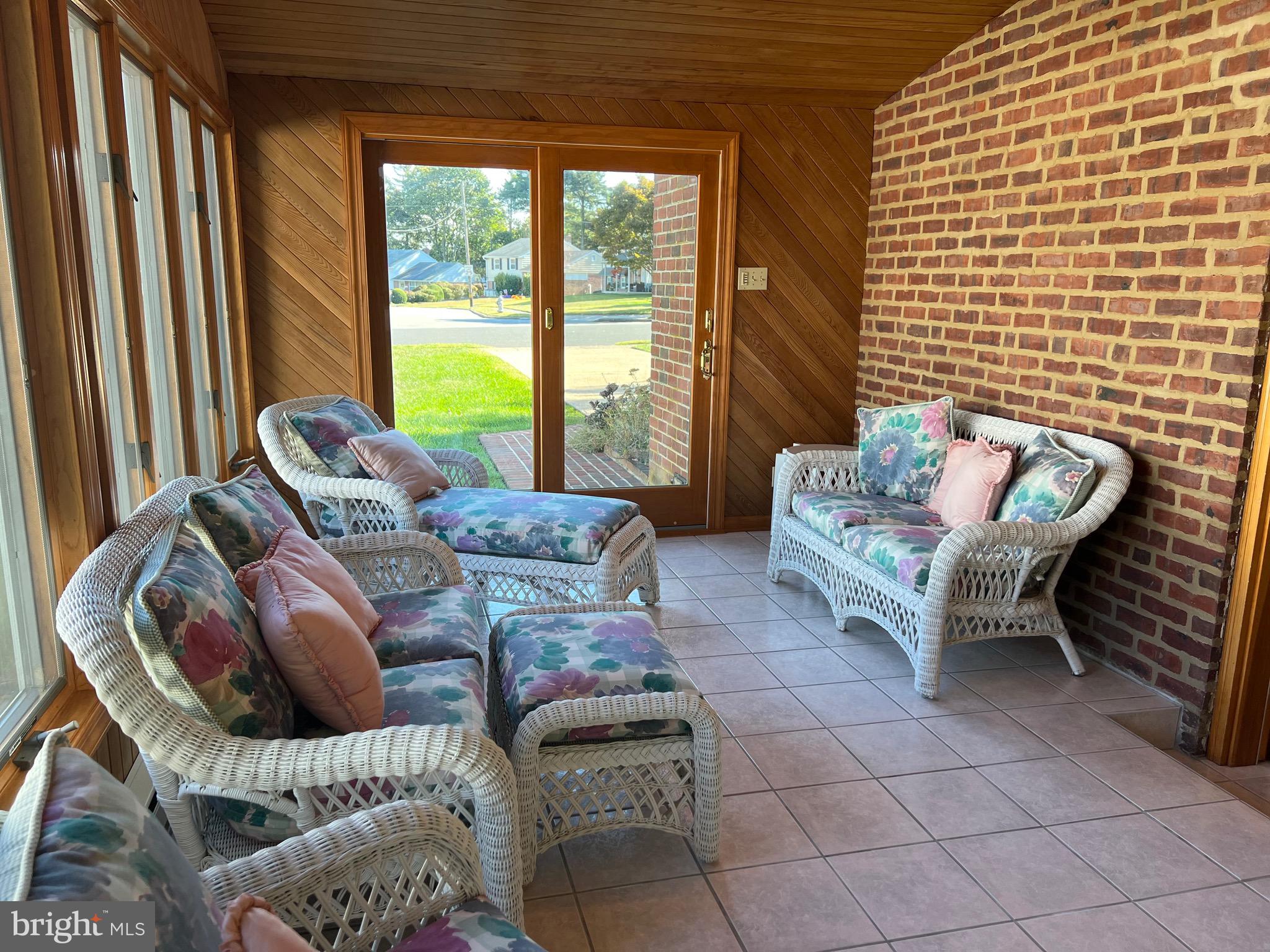 457 Kennerly Road Springfield, PA 19064 - Photo 8 of 9 a living room with furniture and a floor to ceiling window