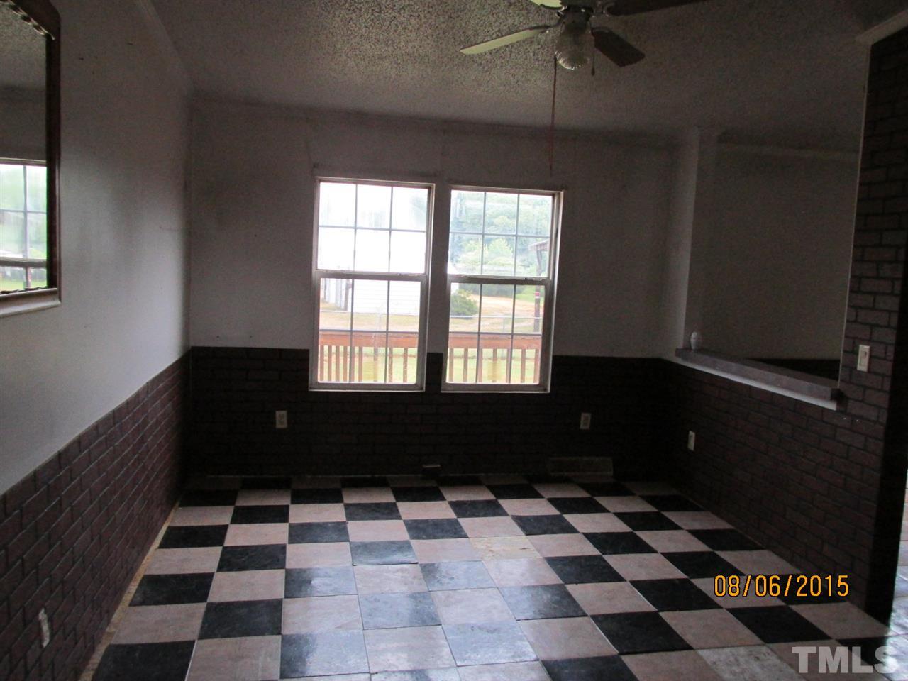 8617 Walter Myatt Road Willow Spring, NC 27592 - Photo 15 of 22 a black and white checkered floor with a black white checkered floor