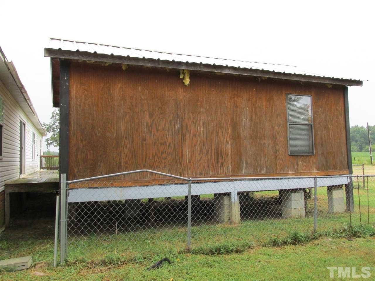 8617 Walter Myatt Road Willow Spring, NC 27592 - Photo 3 of 22 a front view of a house