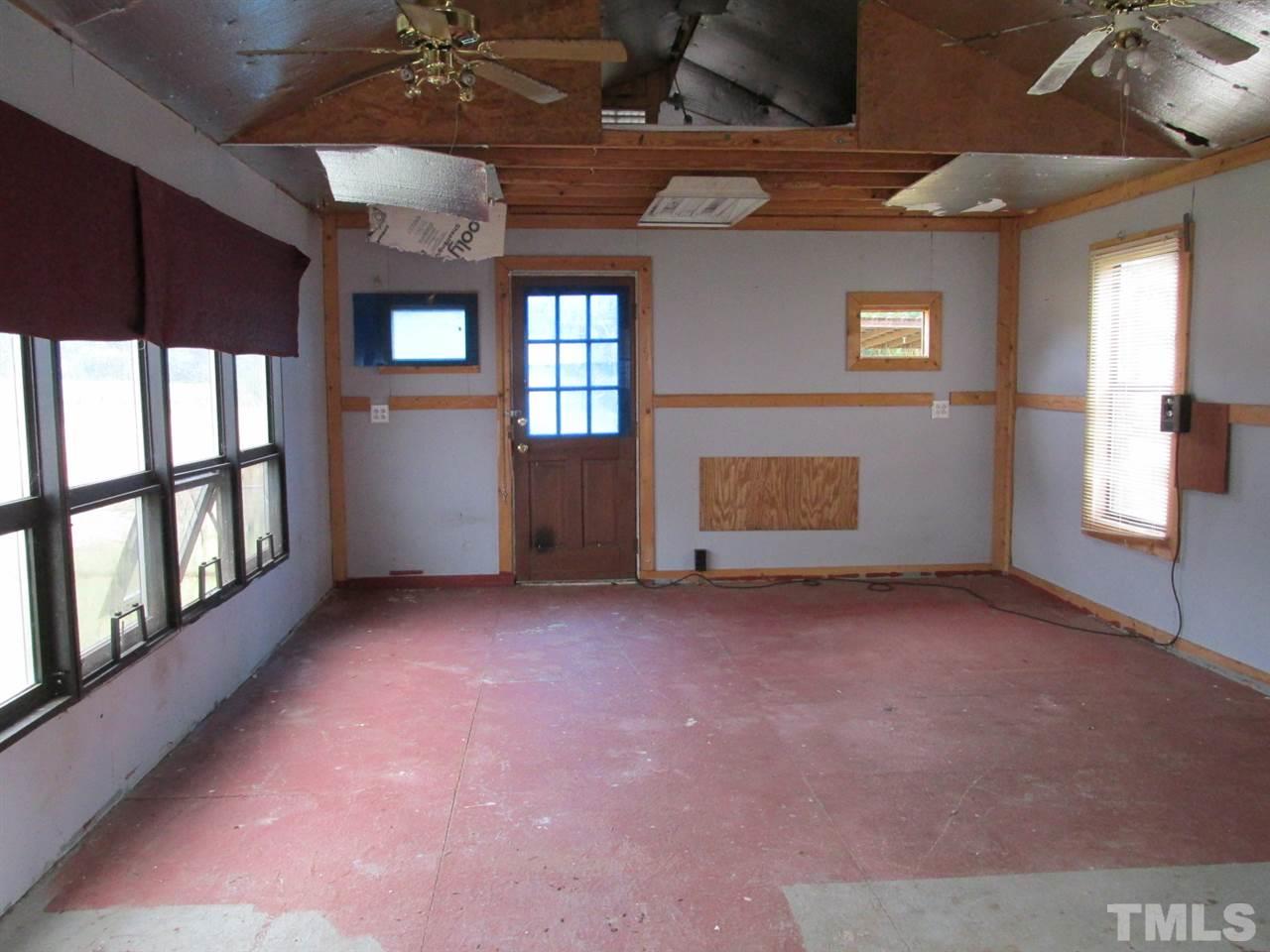 8617 Walter Myatt Road Willow Spring, NC 27592 - Photo 5 of 22 a view of an empty room with a window