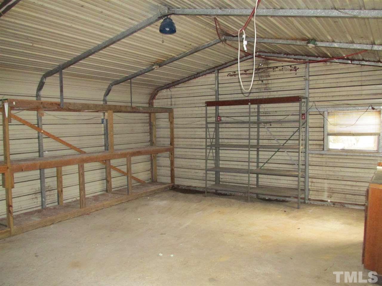 8617 Walter Myatt Road Willow Spring, NC 27592 - Photo 8 of 22 a view of a garage