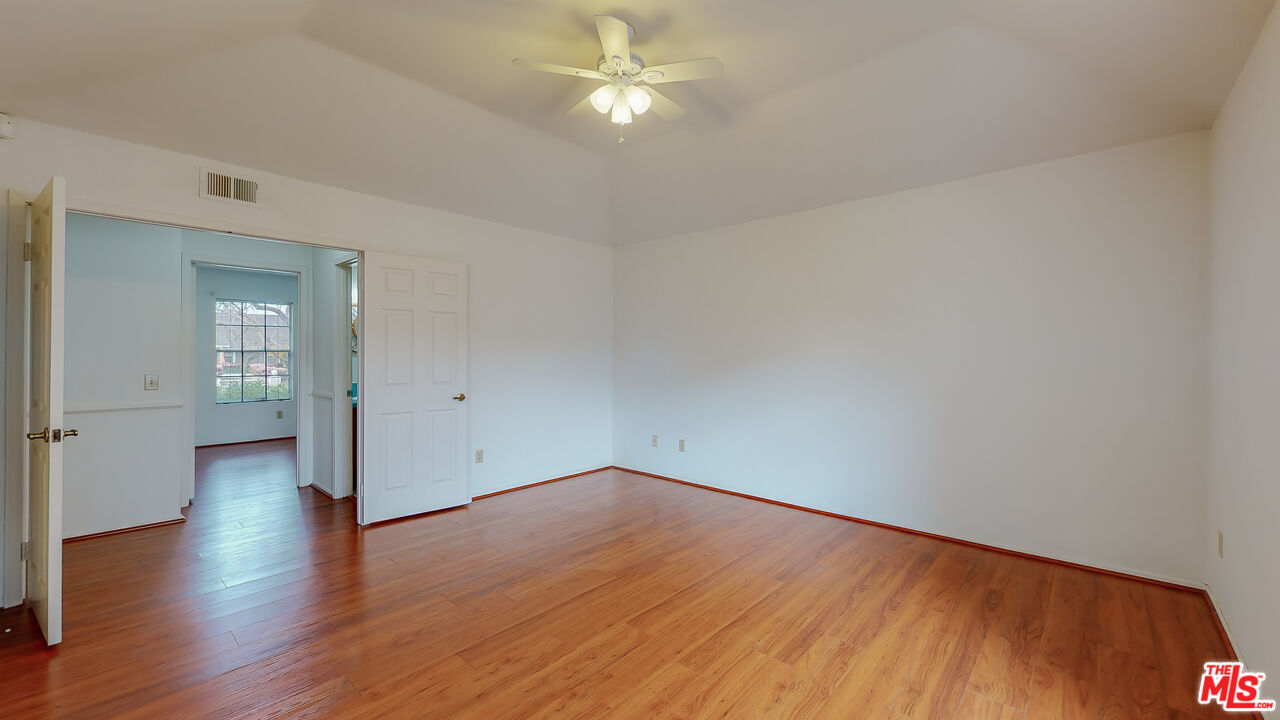 17 Firestone Irvine, CA 92614 - Photo 28 of 75 an empty room with wooden floor closet and windows