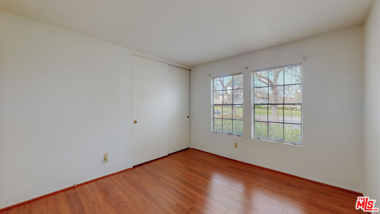 17 Firestone Irvine, CA 92614 - Photo 34 of 75 an empty room with wooden floor and windows