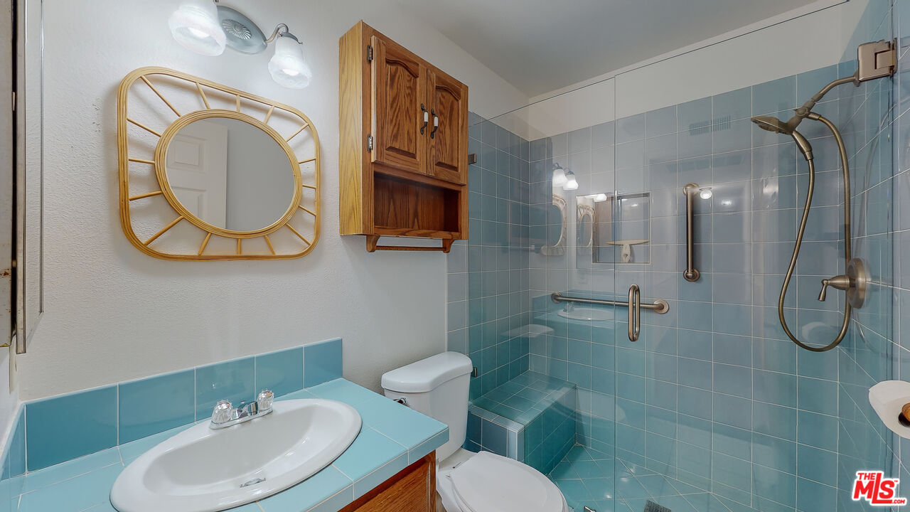 17 Firestone Irvine, CA 92614 - Photo 38 of 75 a bathroom with a toilet sink and mirror