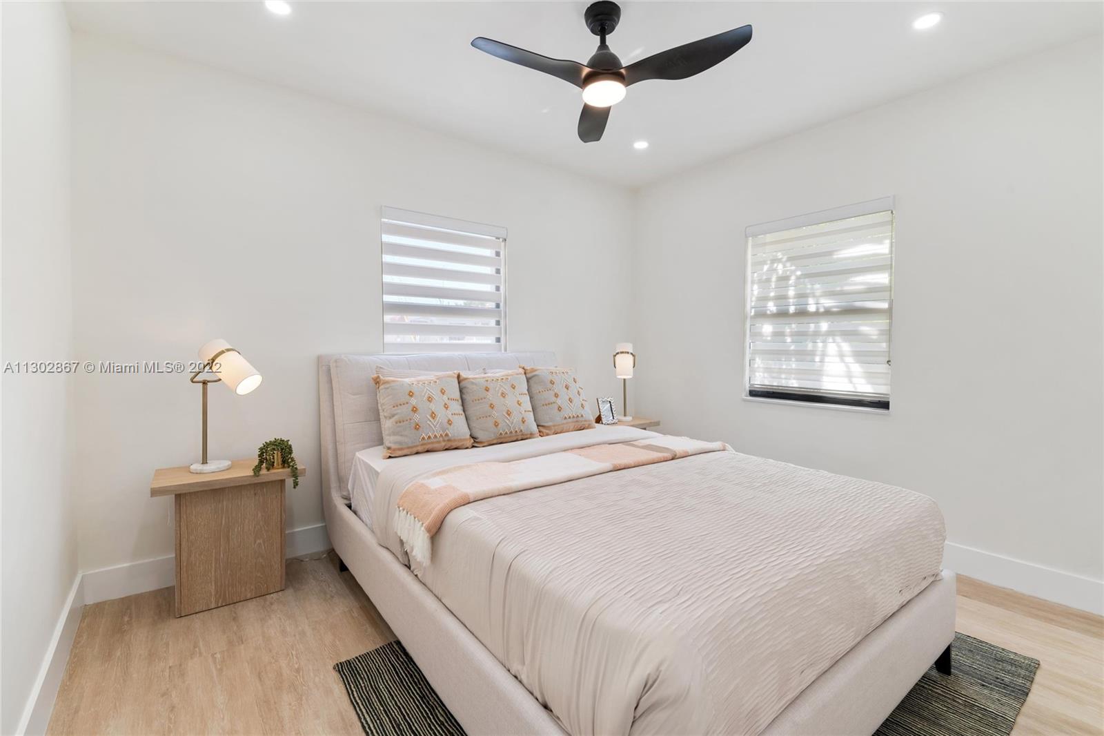 2324 Southwest 58th Court Miami, FL 33155 - Photo 12 of 25 a bedroom with bed and a window