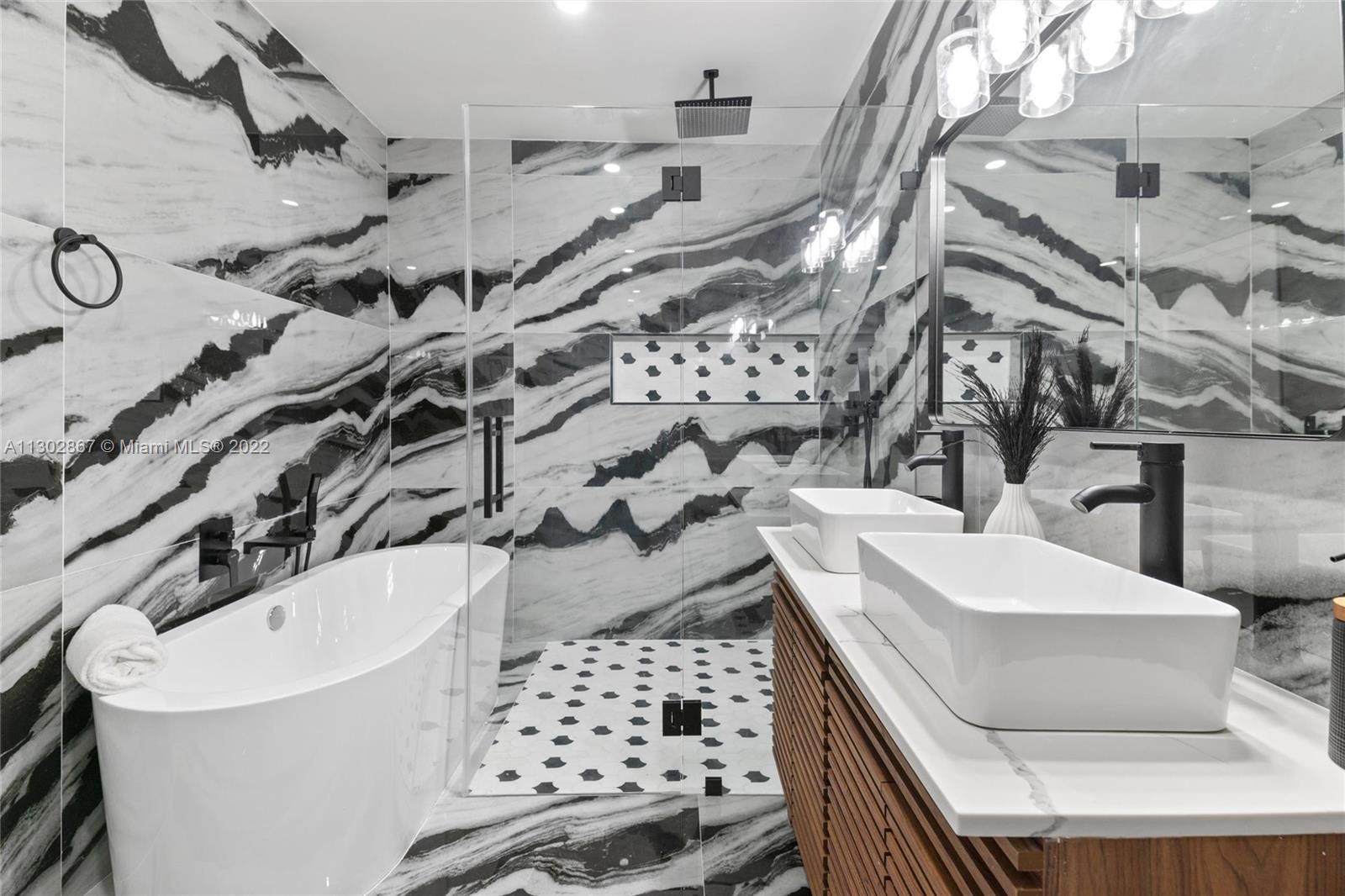 2324 Southwest 58th Court Miami, FL 33155 - Photo 20 of 25 a bathroom with a bathtub and shower