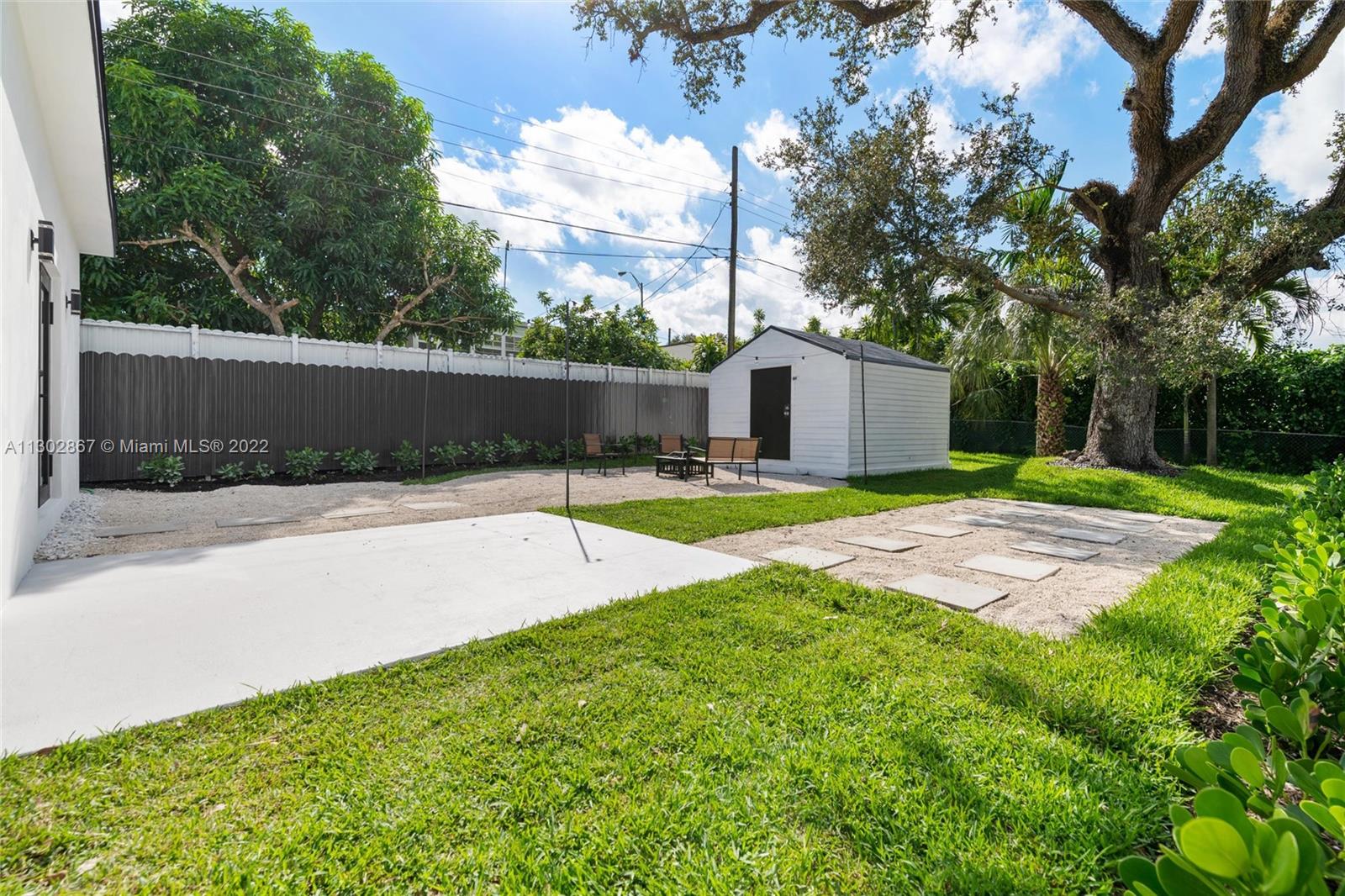 2324 Southwest 58th Court Miami, FL 33155 - Photo 23 of 25 a swimming pool with wooden fence