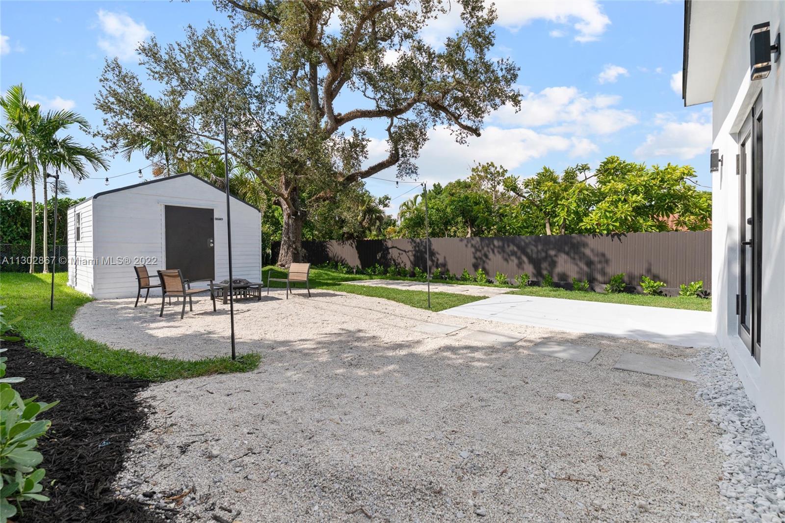 2324 Southwest 58th Court Miami, FL 33155 - Photo 24 of 25 a swimming pool with outdoor seating and yard