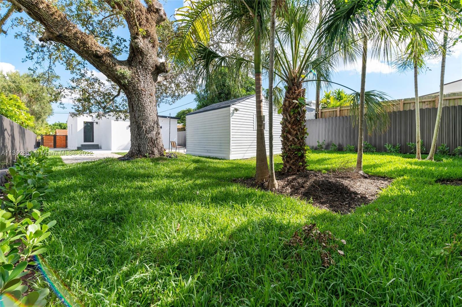2324 Southwest 58th Court Miami, FL 33155 - Photo 25 of 25 a view of a garden with a tree