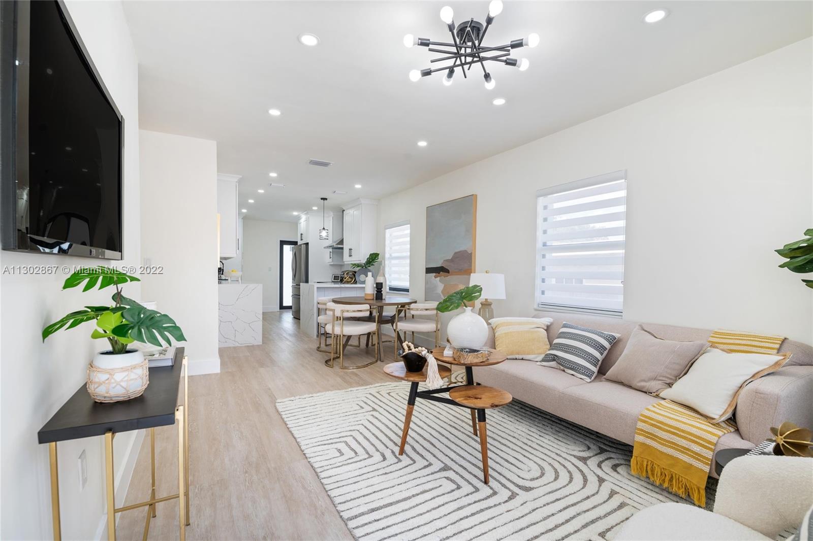 2324 Southwest 58th Court Miami, FL 33155 - Photo 4 of 25 a living room with furniture and a flat screen tv