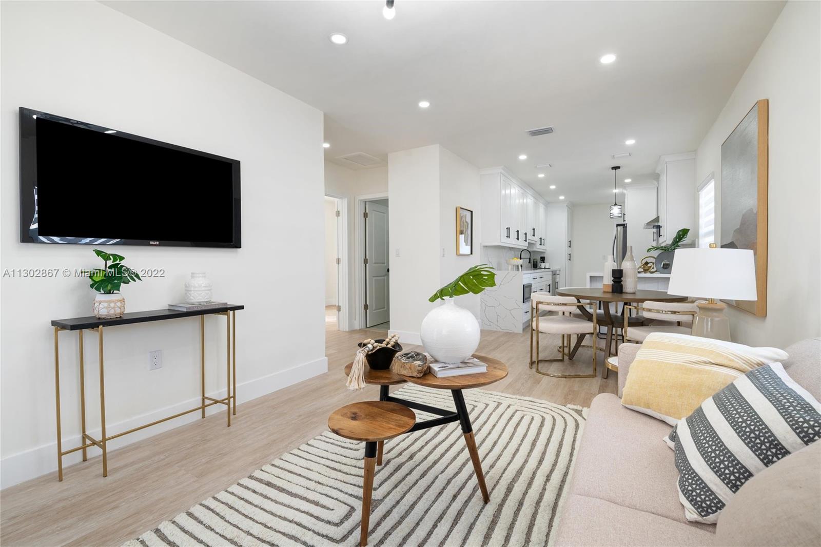 2324 Southwest 58th Court Miami, FL 33155 - Photo 5 of 25 a living room with furniture and a flat screen tv