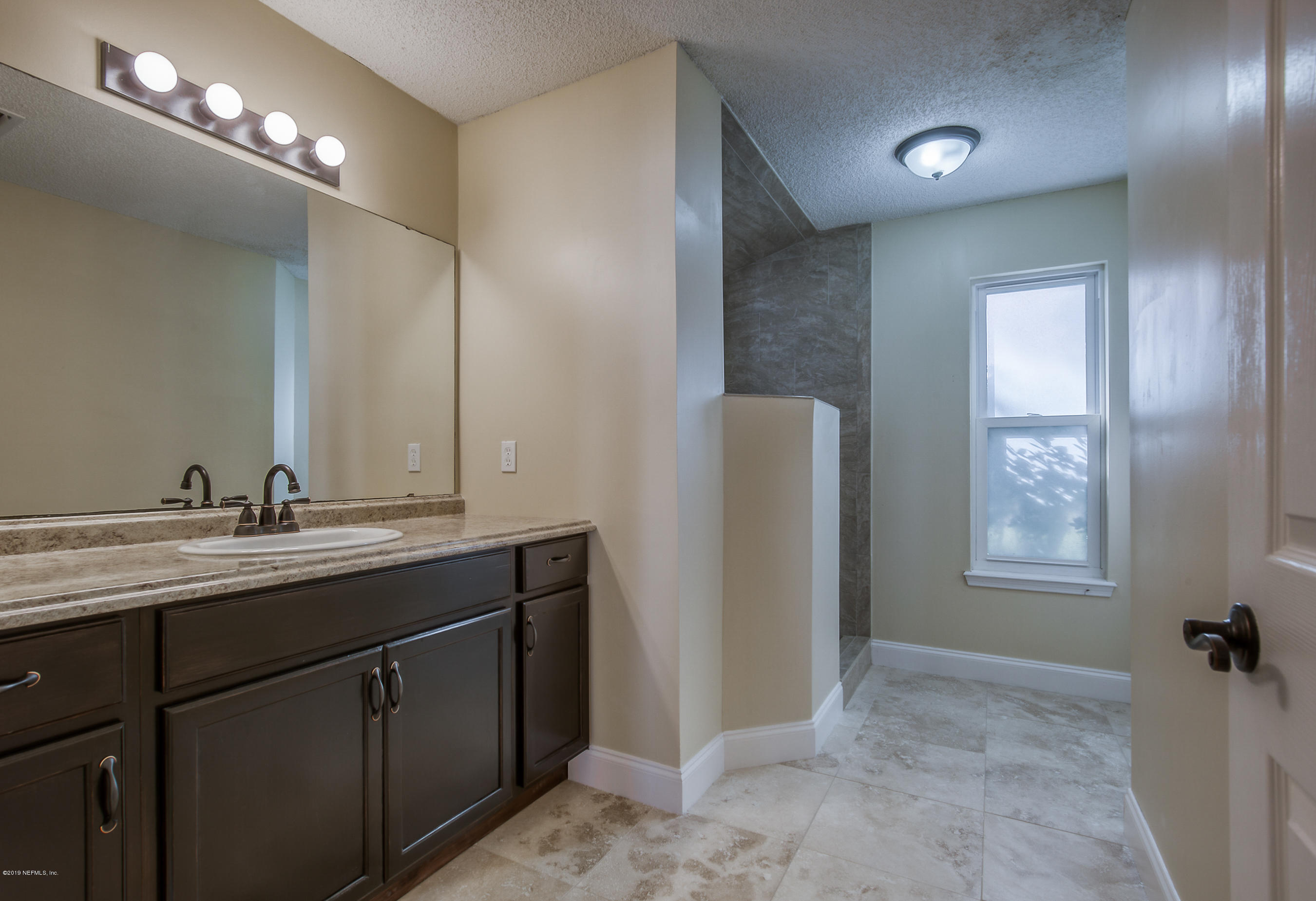 8455 Ivey Road Jacksonville, FL 32216 - Photo 5 of 22 master bathroom
